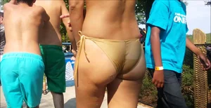 Sexy latino booty in gold bikini at Wonderland