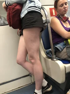 Hot Legs of a Candid Girl in Shorts Standing in a Subway Train Creepshots