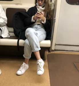 Cute and grumpy looking candid girl wearing jeans in subway creepshots