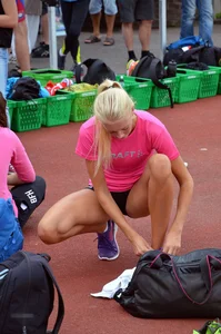 Sexy blonde track sprinter changing after a race