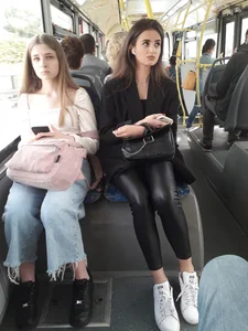 Gorgeous candid chick wearing tight leather pants sitting in a public bus creepshots