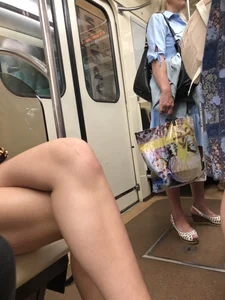 Tall Candid Teen Girl in Denim Shorts And Sandals Sitting in the Subway Train, Then Walking Down the Station