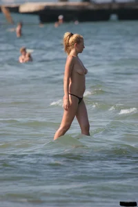 A bunch of sexy beach voyeur babes in bikinis, thongs and topless