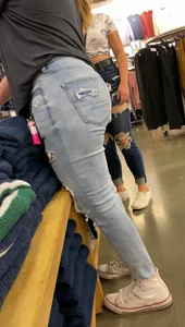 Two blonde teens shopping
