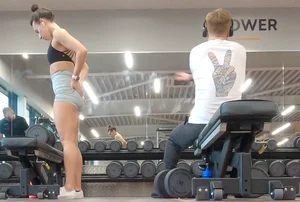 Gym brunette in tight grey shorts bending over, part 3