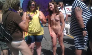 Nude small boobed girl at Toronto pride parade with a couple bonus girls
