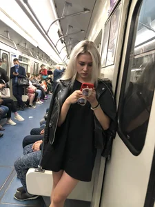 Blonde in a Dress and Sneakers With Sexy Skinny Legs in the Subway Train and on the Escalator Closeup Candid Photos