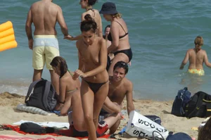 Topless girls on a beach in Barcelona