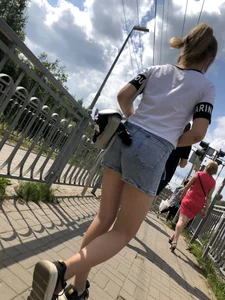 Cute Girl in Denim Shorts Walking Down a Railway Station Gallery