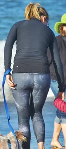 Beach redhead milf in patterened leggings at the beach