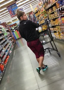 Milf grocery shopping in red leggings with a great ass