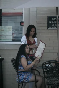 Two sexy Tilted Kilt employees showing cleavage and cheeks