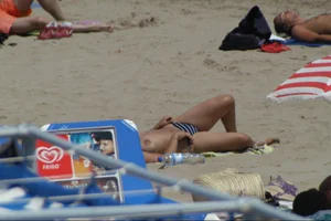 Girls on a nude beach in Sitges, Spain