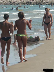 Bunch of sexy babes at the beach in thong bikinis