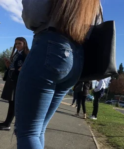 Long haired beauty teen with a tight ass in jeans