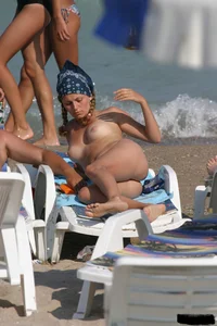 Beach voyeur girls in bikinis, thongs and topless