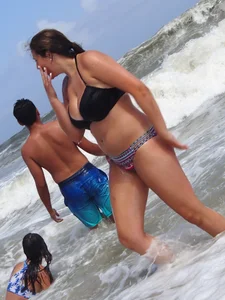 Thick beach girl with massive boobs