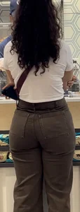 Bubble booty in tight jeans at the store closeups