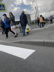 Candid teen girl wearing a skirt and white pantyhose crossing the street creepshots