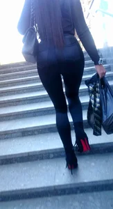 Hot booties of girls wearing tight pants, leggings and tight jeans walking up the stairs on the street creepshots