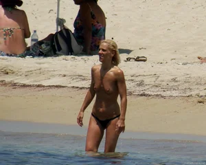 Small boobed topless milf on the beach