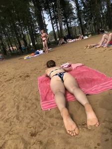 Series of Photos of Sexy Girls in Swimsuits Lying on a Beach With Slightly Spread Legs