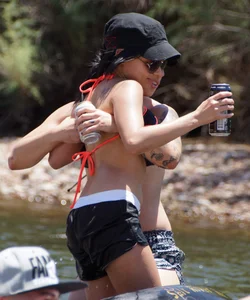 Sexy party girls in bikinis on a lake