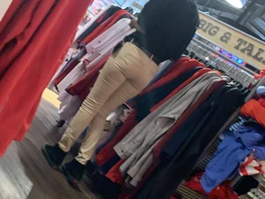 Bunch of girls in various outfits at a Cardinals baseball game