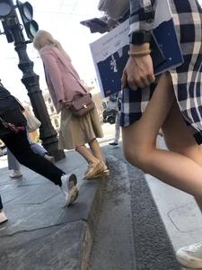 Nice legs of a candid girl crossing the street