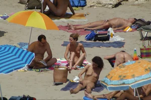Girls on a nude beach in Sitges, Spain