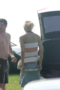 Blonde babe changing into and out of bikini and shows her tits