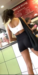hot petite Indian chick showing some T&A in skimpy workout clothes