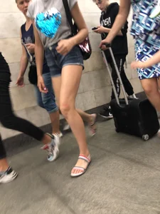 Tall Candid Teen Girl in Denim Shorts And Sandals Sitting in the Subway Train, Then Walking Down the Station