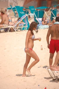 Bunch of sexy girls and milfs in bikinis at the beach