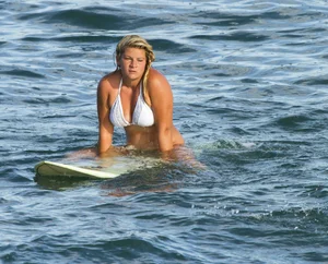 Candid surfer babes on the beach and in bikinis
