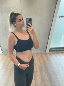 Girl in a Sporting Top And Leggings Showing Off Her Abs, Gym Mirror Selfie