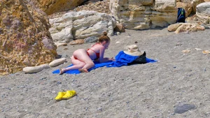 Large collection of hot beach girls lying on the beach and bending over