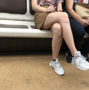 Amazing Hot Girl in a Skirt and Sneakers Sitting Cross-Legged in the Subway Train and on the Escalator Candid Photos Gallery