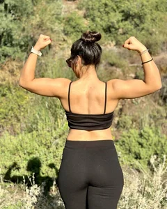 Hot non-candid girl wearing a top and leggings