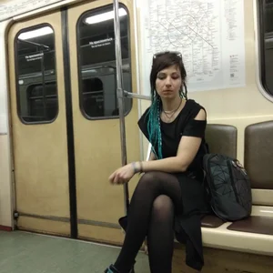 A Gothic Style Girl in a Dress, Black Pantyhose And Massive Boots Sitting With Crossed Legs in a Subway Train Creepshots