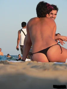 Sexy girls going topless at the beach showing off their sexy bodies