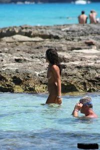 Nude beach ladies in the water showing their tits