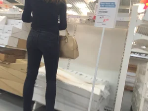 Skinny girl shopping in tight black jeans