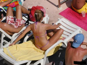 Beach voyeur girls in bikinis, thongs and topless