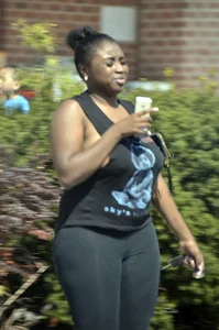Chubby black lady with big tits and no bra lets it slip