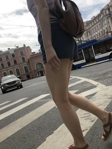 Young Girl in Shorts And Sandals Crossing the Street Gallery