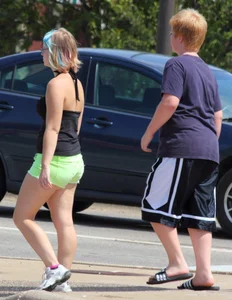 Blonde girl in glasses with a thick booty in green shorts