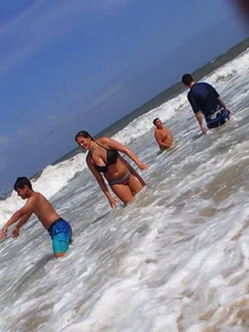 Thick beach girl with massive boobs