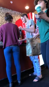 Latina in Nike leggings at the wing shop