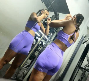 Girl in lilac short leggings at the gym